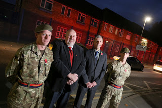 J Tomlinson helps army reserve centre light up in red